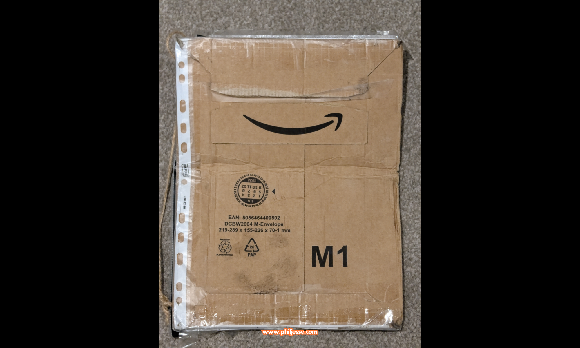 Reverse of Amazon parcel packaging featuring the Amazon logo.