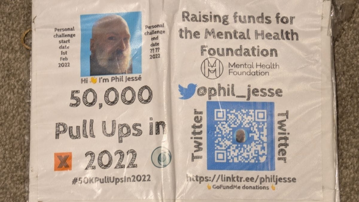 The official sign for Phil Jessé's 50,000 Pull-Up Challenge, highlighting the partnership with the Mental Health Foundation.